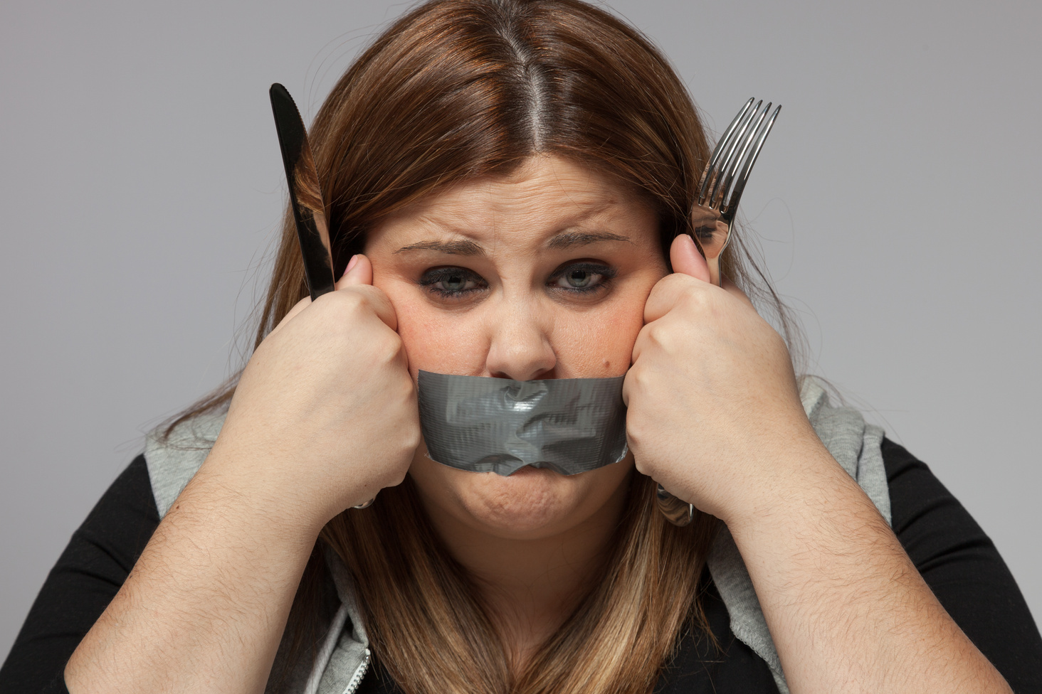 Sad Plus Size Woman with Adhesive Tape on Mouth